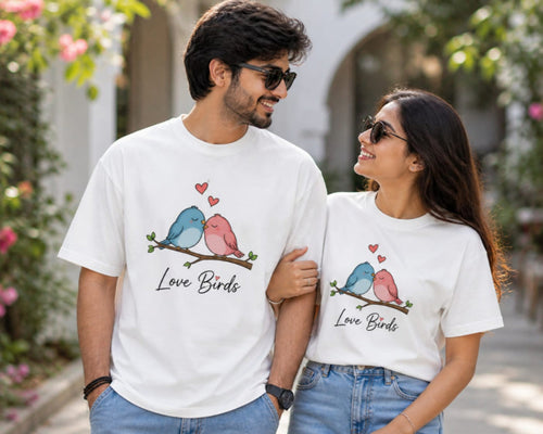 Two people wearing matching white t-shirts with 'Love Birds' design outdoors.